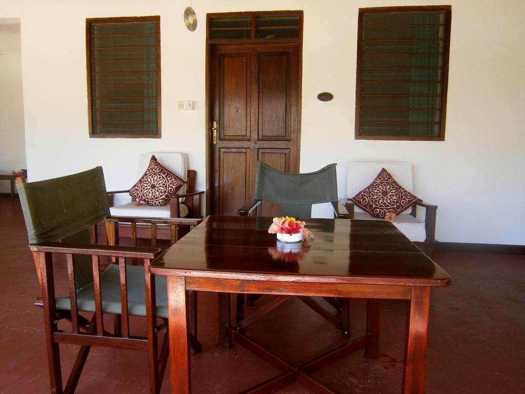 Flame Tree Cottages Nungwi Rom bilde